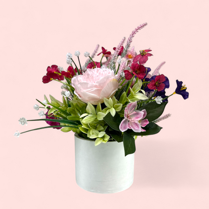 Blushing Bloom – Pink & Purple Faux Floral Arrangement in Cement Planter
