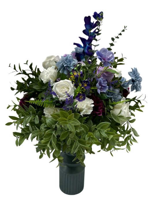 floral arrangement with blue, purple and white flowers giving a masculine vibe