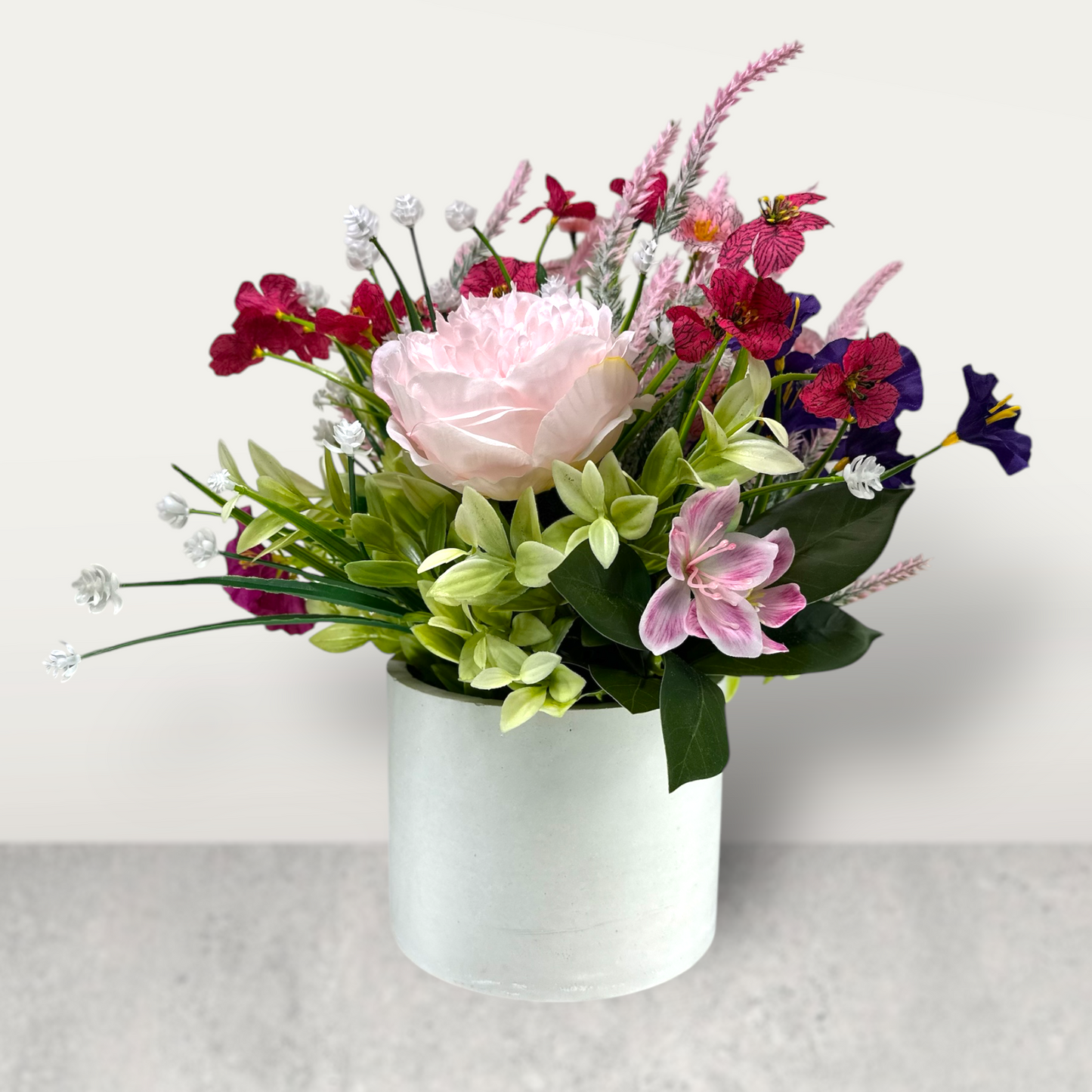 Blushing Bloom – Pink & Purple Faux Floral Arrangement in Cement Planter